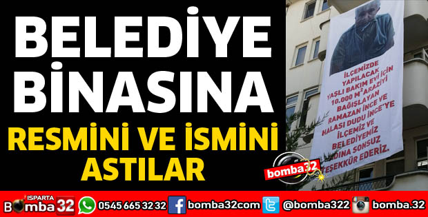 BELEDİYE BİNASINA İSMİNİ VE RESMİNİ ASTILAR