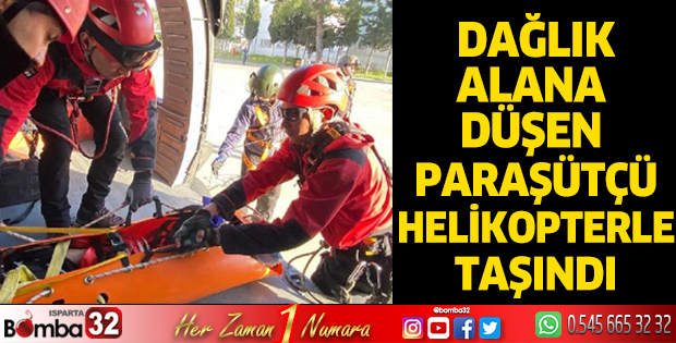 Dağlık alana düşen paraşütçü, jandarma helikopteriyle taşındı