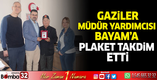 Gaziler, Müdür Yardımcısı Bayam’a plaket takdim etti