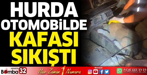 Hurda otomobilde sıkışan köpek kurtarıldı