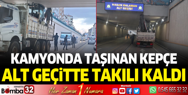Isparta'da kamyonda taşınan kepçe alt geçitte takılı kaldı