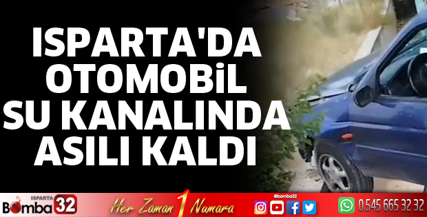 Otomobil su kanalında asılı kaldı