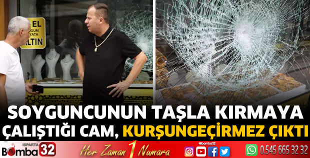 Soyguncunun taşla kırmaya çalıştığı cam, kurşungeçirmez çıktı
