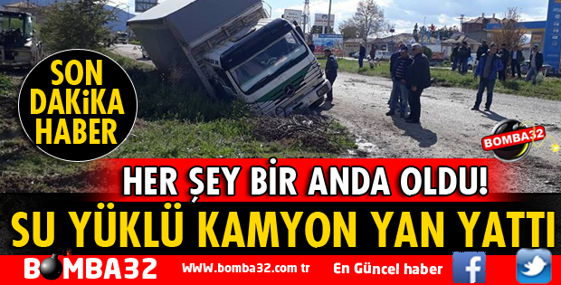 SU YÜKLÜ KAMYON YAN YATTI