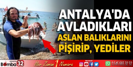 Antalya'da avladıkları aslan balıklarını pişirip, yediler