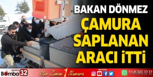 Bakan Dönmez çamura saplanan aracı itti