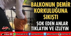 BALKONUN DEMİR KORKULUKLARINA SIKIŞTI