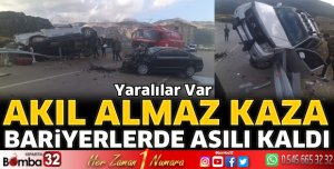 Bariyerlere asılı kaldı