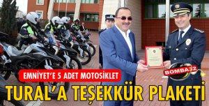 BAŞKAN TURAL'A PLAKET