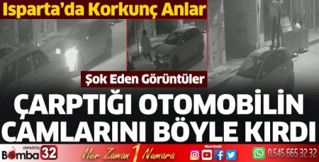 Çarptığı otomobilin camlarını böyle kırdı