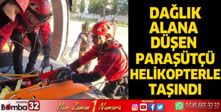 Dağlık alana düşen paraşütçü, jandarma helikopteriyle taşındı