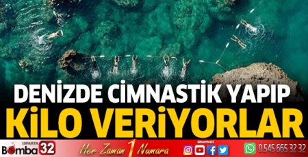 Denizde cimnastik yapıp kilo veriyorlar
