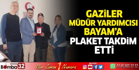 Gaziler, Müdür Yardımcısı Bayam’a plaket takdim etti