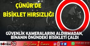 GÜVENLİK KAMERALARINI ALDIRMADAN, BİNANIN ÖNÜNDEKİ BİSİKLETİ ÇALDI