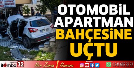Hafif ticari araçla çarpışan otomobil, apartman bahçesine uçtu