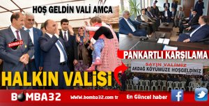 HALKIN VALİSİNE SEVGİ SELİ  PANKARTLI KARŞILAMA