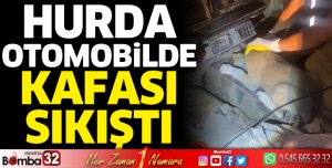Hurda otomobilde sıkışan köpek kurtarıldı