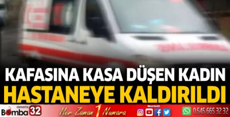 Kafasına kasa düşen kadın yaralandı