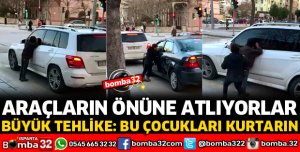 KIRMIZI IŞIKLARDA ARAÇLARIN ÖNÜNE ATLIYORLAR