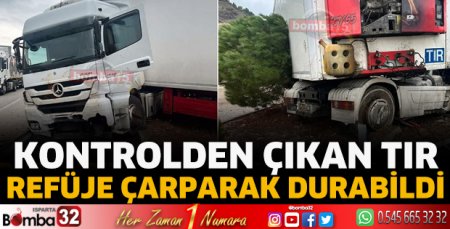Kontrolden çıkan tır refüje çarparak durabildi