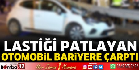 Lastiği patlayan otomobil bariyere çarptı