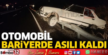 Otomobil bariyerlerde asılı kaldı