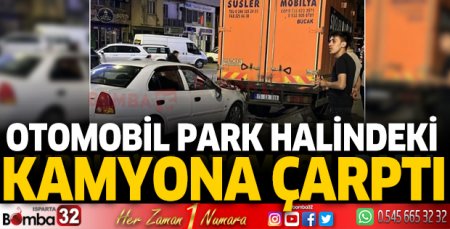 Otomobil, park halindeki kamyona çarptı
