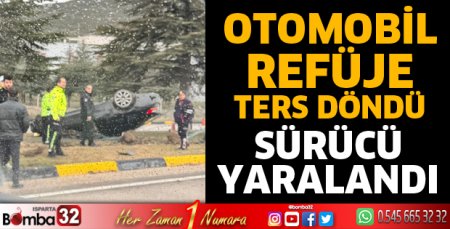 Otomobil refüje ters döndü