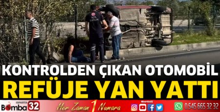 Otomobil refüje yan yattı