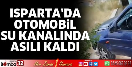 Otomobil su kanalında asılı kaldı