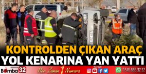 Otomobil yol kenarına yan yattı