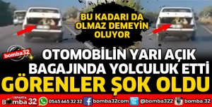 OTOMOBİLİN YARI AÇIK BAGAJINDA YOLCULUK YAPTI