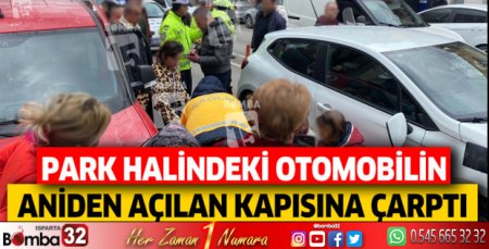 Park halindeki otomobilin aniden açılan kapısına çarptı