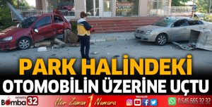 Park halindeki otomobilinin üzerine uçtu