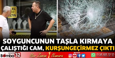 Soyguncunun taşla kırmaya çalıştığı cam, kurşungeçirmez çıktı