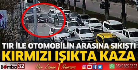 Tır ile otomobil arasına sıkıştı