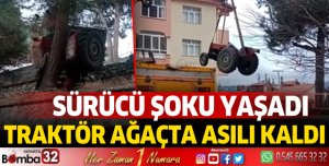 TRAKTÖR AĞAÇTA ASILI KALDI