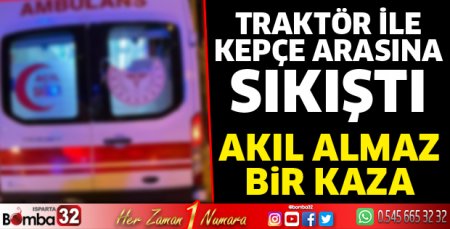 Traktör ile kepçe arasına sıkıştı