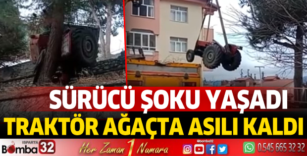 TRAKTÖR AĞAÇTA ASILI KALDI